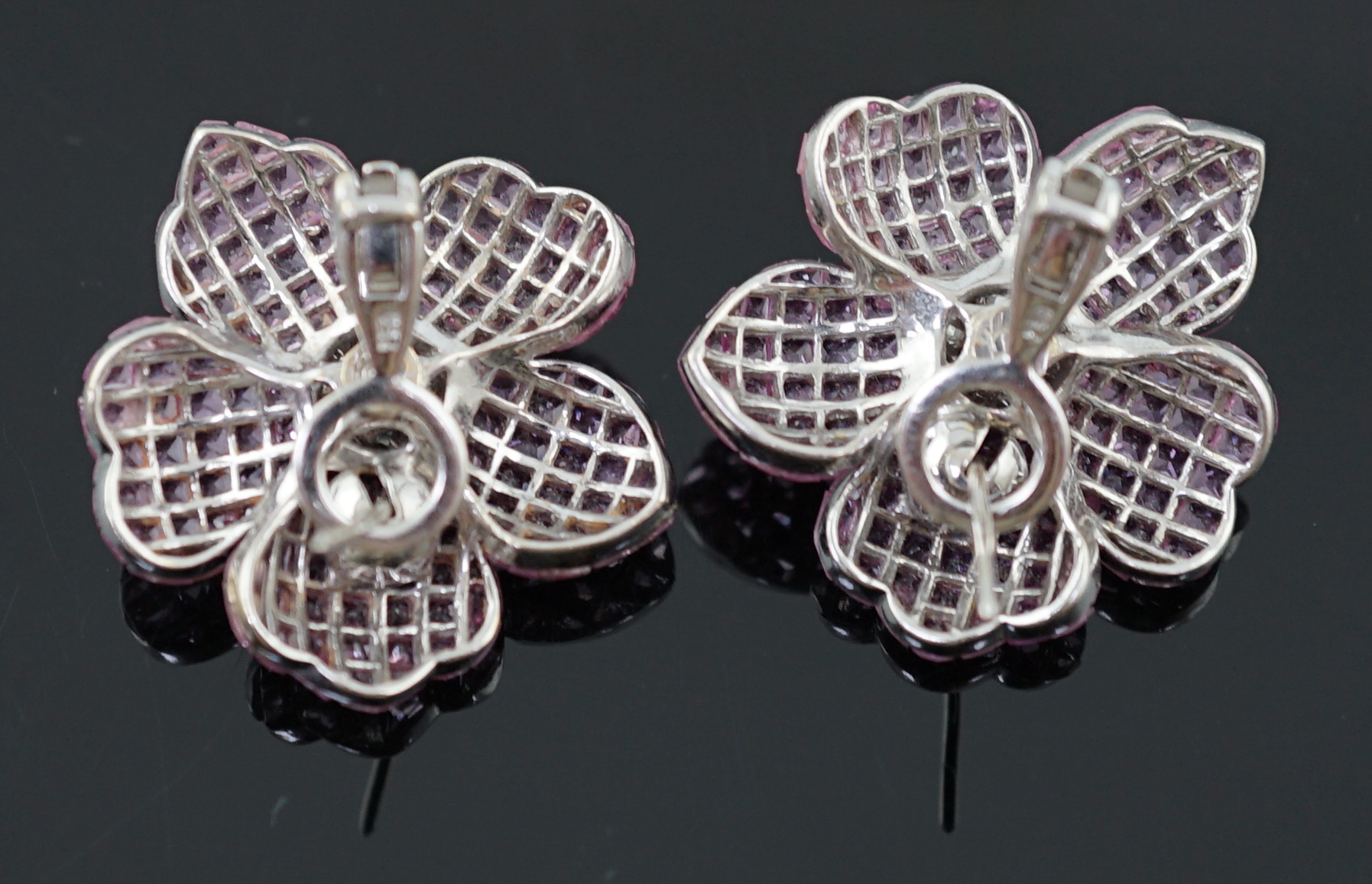 A pair of 18k white gold, pink sapphire and diamond cluster set flower head ear clips/earrings